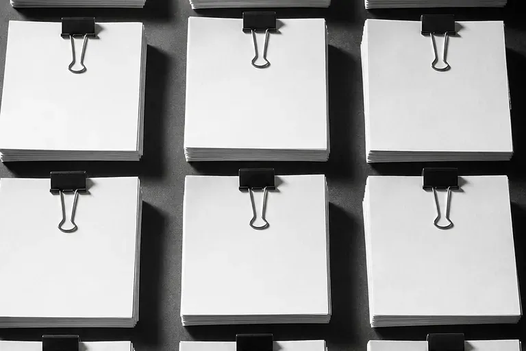 Rows of clipped paper stacks, one per account